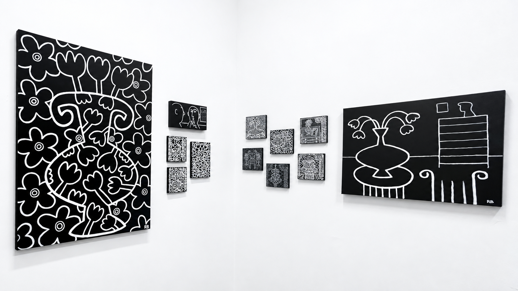 Installation view, gallery corner with black-and-white canvases