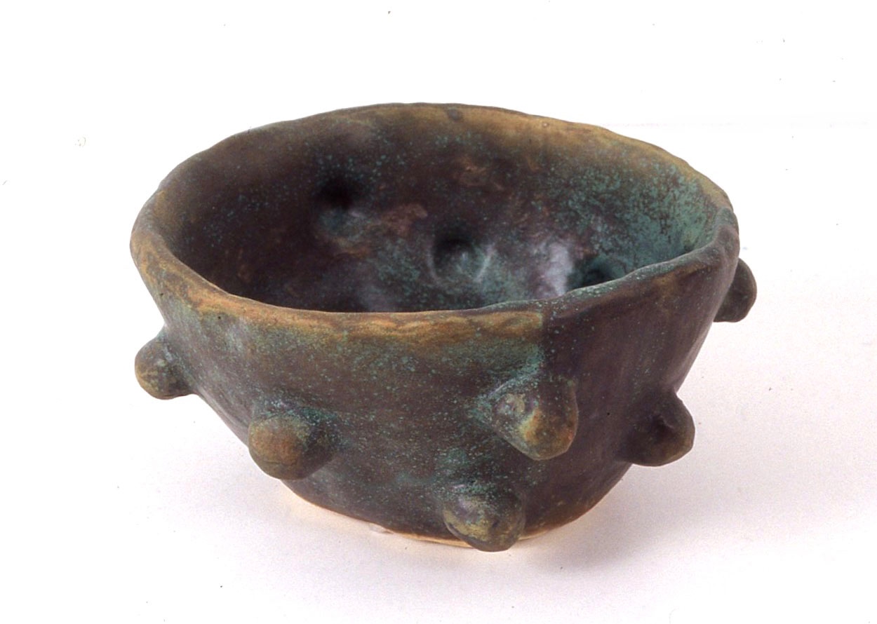 Footed ceramic bowl with applied nubs